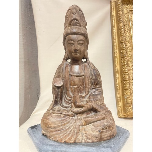 287 - An Antique Oriental carved wood Buddha, on later slate base, height 26cm