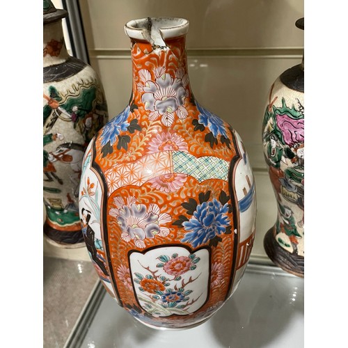 277 - A Japanese porcelain bottle and stopper, with hand painted decoration, 6 character mark, height 27cm... 