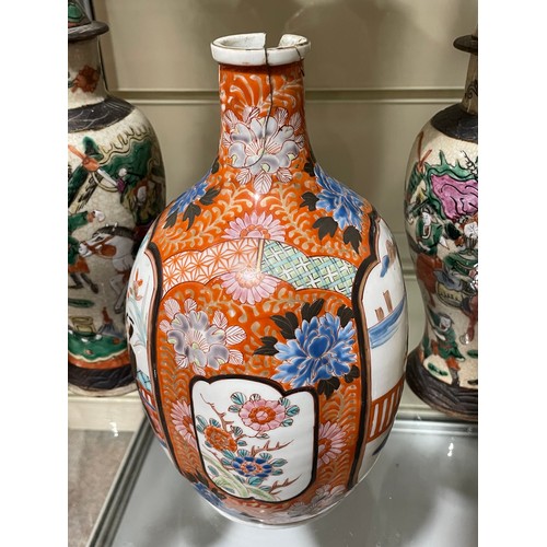 277 - A Japanese porcelain bottle and stopper, with hand painted decoration, 6 character mark, height 27cm... 