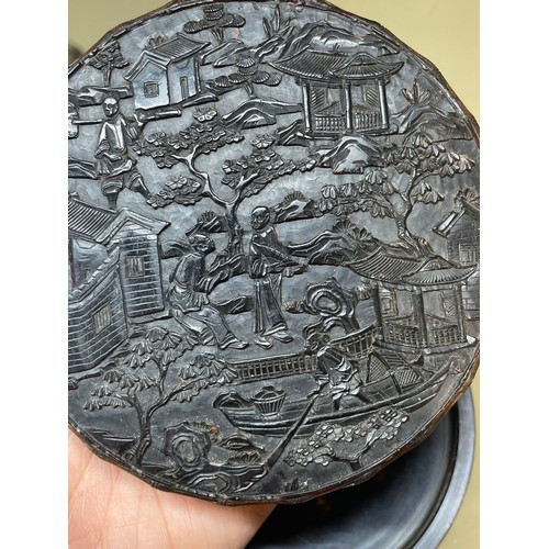 316 - A large Chinese tortoiseshell circular box, allover high relief carved landscape scenes, diameter 9.... 