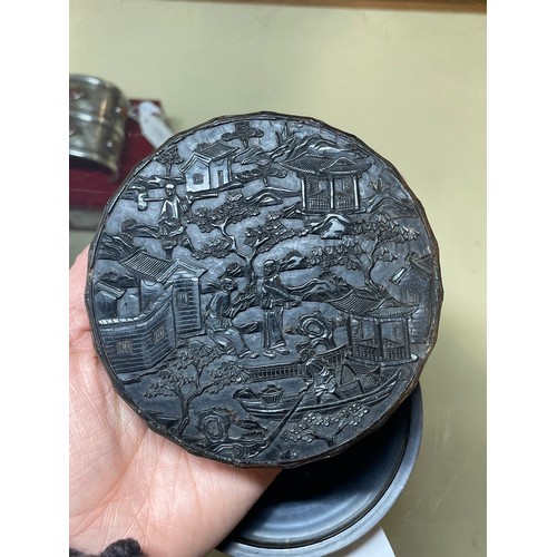 316 - A large Chinese tortoiseshell circular box, allover high relief carved landscape scenes, diameter 9.... 