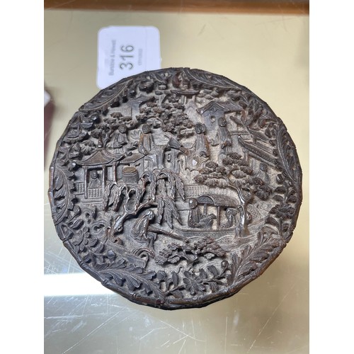 316 - A large Chinese tortoiseshell circular box, allover high relief carved landscape scenes, diameter 9.... 