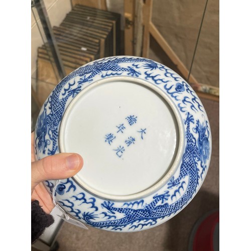 356 - A Chinese blue and white porcelain dragon dish, 6 character mark, diameter 16.5cm