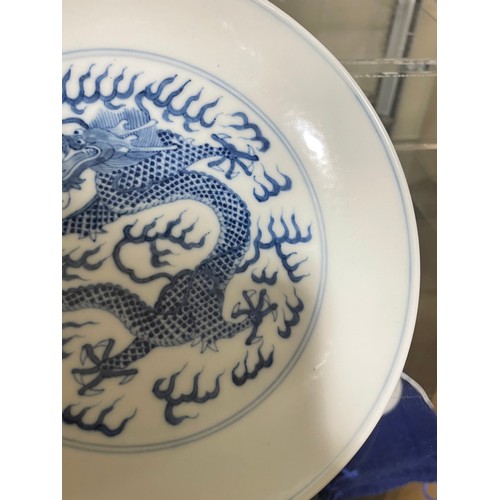 356 - A Chinese blue and white porcelain dragon dish, 6 character mark, diameter 16.5cm