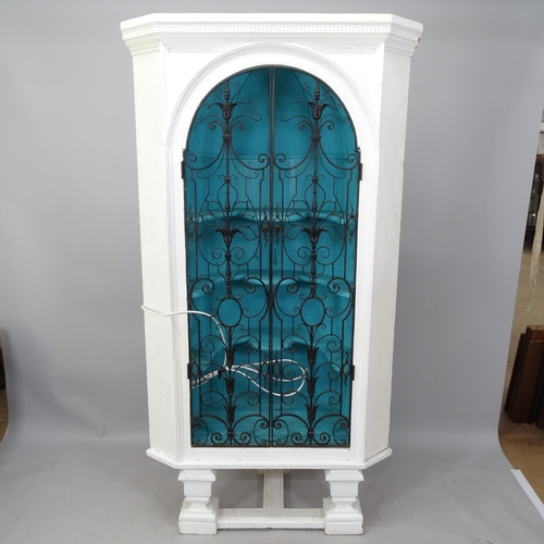 2166 - A painted pine corner cupboard with wrought-iron doors, 105 x 200 x 52cm