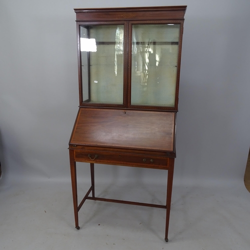 2180 - An Edwardian mahogany and satinwood-strung 2-section bureau bookcase, the fall-front revealing a fit... 