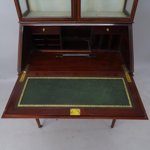 2180 - An Edwardian mahogany and satinwood-strung 2-section bureau bookcase, the fall-front revealing a fit... 