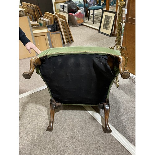 265 - A pair of 19th century upholstered wing armchairs in Queen Anne style, on walnut cabriole legs