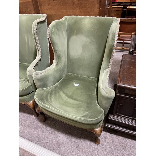 265 - A pair of 19th century upholstered wing armchairs in Queen Anne style, on walnut cabriole legs