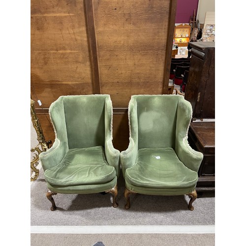 265 - A pair of 19th century upholstered wing armchairs in Queen Anne style, on walnut cabriole legs