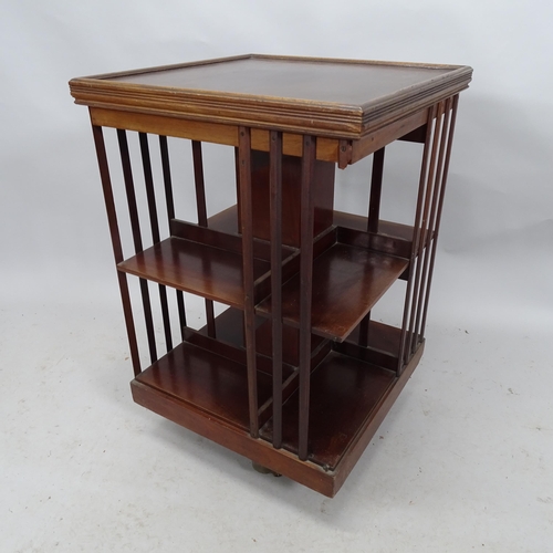 2200 - An antique mahogany three-tier revolving boocase. 54cm x 82cm