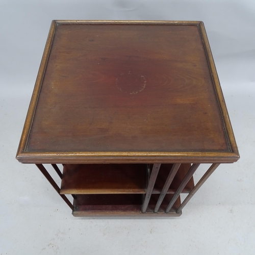 2200 - An antique mahogany three-tier revolving boocase. 54cm x 82cm