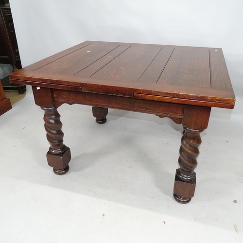 2206 - An early 20th century oak draw-leaf dining table on barley twist legs. 113cm (extending to 199cm) x ... 