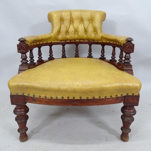 2207 - A Victorian button-back leather upholstered bow arm desk chair