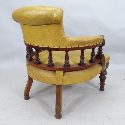 2207 - A Victorian button-back leather upholstered bow arm desk chair