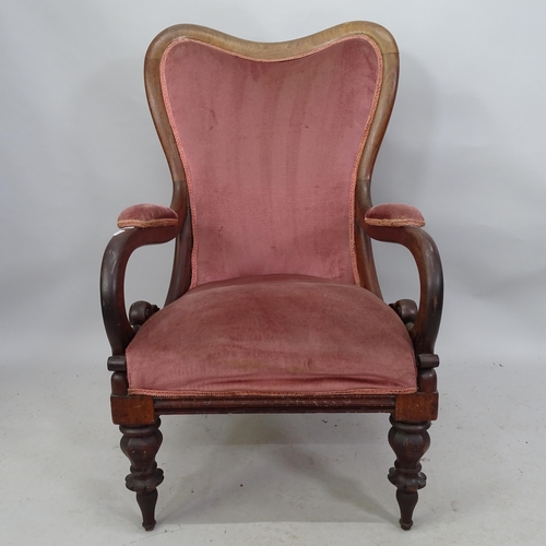 2214 - A Victorian and mahogany upholstered open armchair.