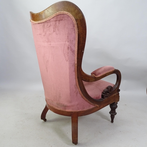 2214 - A Victorian and mahogany upholstered open armchair.