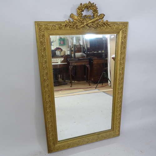 2219 - A 19th century gilt-framed wall mirror with brocade decoration. 82cm x 137cm