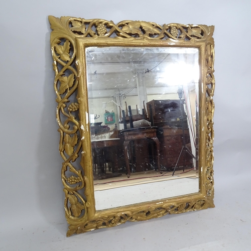 2222 - A French carved and gilt painted oak framed wall mirror. 95cm x 115cm