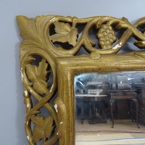 2222 - A French carved and gilt painted oak framed wall mirror. 95cm x 115cm