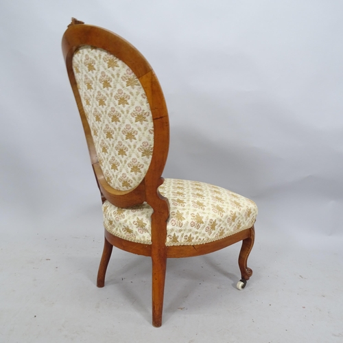 2225 - A Victorian mahogany and button-back upholstered nursing chair with carved decoration.