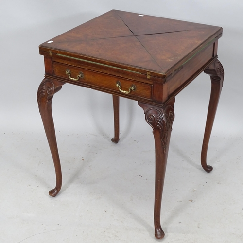 2238 - A Victorian walnut envelope card table, with single frieze drawer raised on cabriole legs. 60cm (ext... 