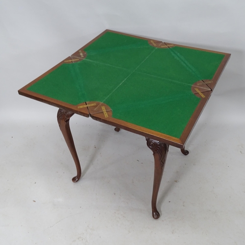 2238 - A Victorian walnut envelope card table, with single frieze drawer raised on cabriole legs. 60cm (ext... 