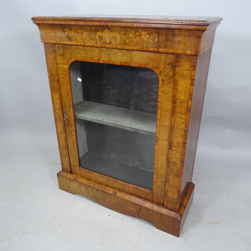 2243 - A Victorian walnut pier cabinet with single glazed door. 86cm x 108cm x 35cm (with key)