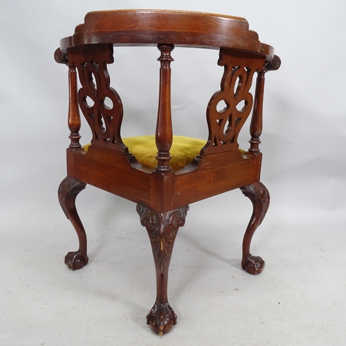 2245 - A mahogany corner armchair on cabriole legs with claw and ball feet.