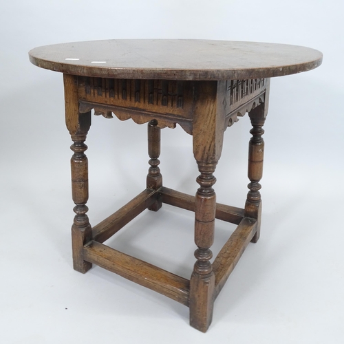 2270 - An Ipswich oak design circular-top occasional table, with carved decoration and all-round stretcher,... 