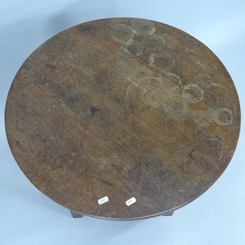 2270 - An Ipswich oak design circular-top occasional table, with carved decoration and all-round stretcher,... 