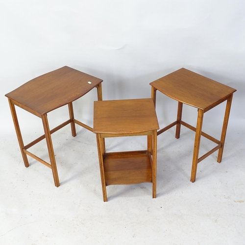 2250 - A 1930s nest of three teak occasional tables, with label for Waring and Gillows. Largest 46cm x 54cm... 