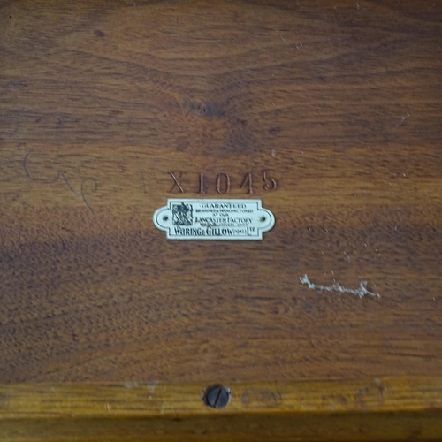 2250 - A 1930s nest of three teak occasional tables, with label for Waring and Gillows. Largest 46cm x 54cm... 