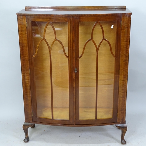 2252 - A 1930s two door display cabinet, with two fitted glass shelves, raised on cabriole legs. 89cm x 116... 