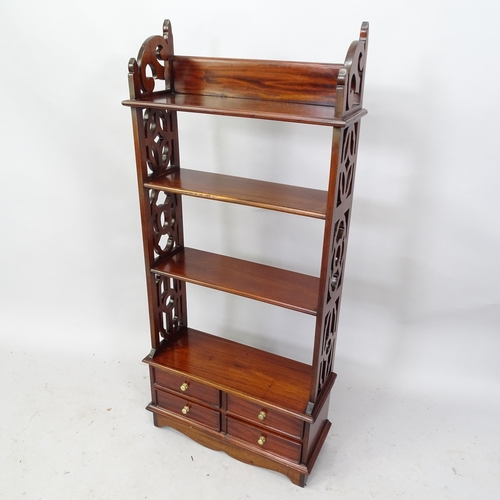 2254 - A mahogany arts and crafts style open bookcase with four fitted drawers to base. 52cm x 114cm x 20cm