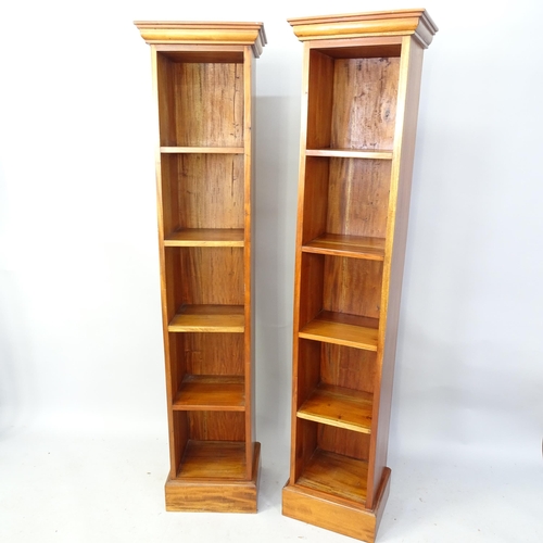 2256 - A pair of modern teak narrow bookshelves, each having four fixed shelves. 42cm x 182cm x 32cm