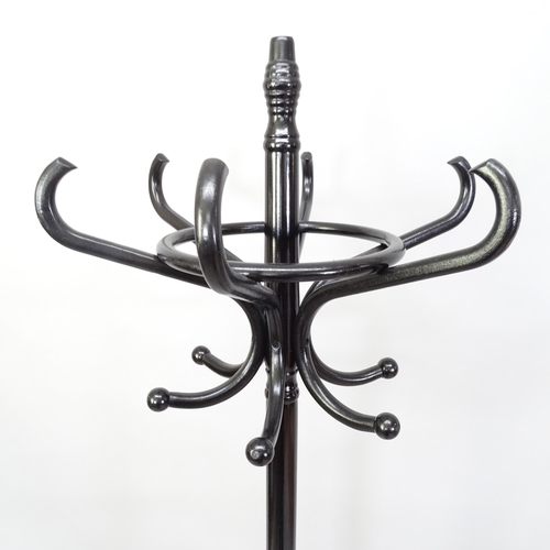 2259 - A black lacquered bentwood hat and coat stand in the manner of Thonet. 53cm x 185cm