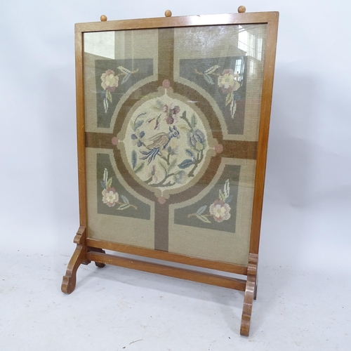 2265 - An Arts and Crafts fire screen with glazed tapestry panel in the manner of Pugin. 59 x 84 x 25cm.