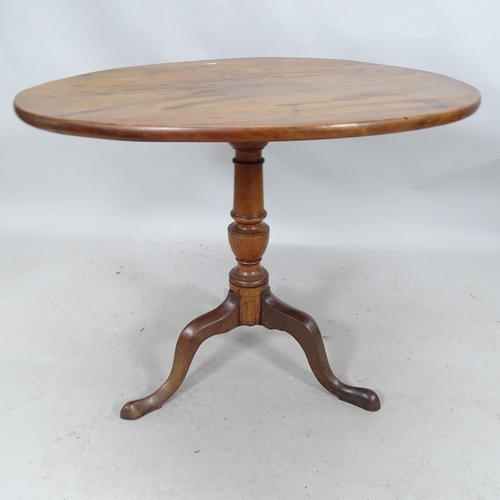 2276 - A Georgian mahogany circular tilt top table on tripod base. 84 x 71cm.