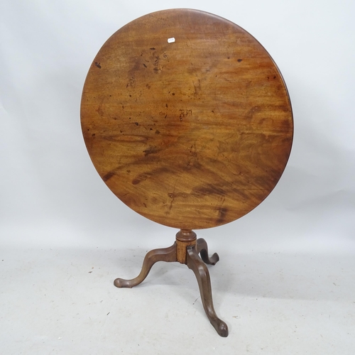 2276 - A Georgian mahogany circular tilt top table on tripod base. 84 x 71cm.