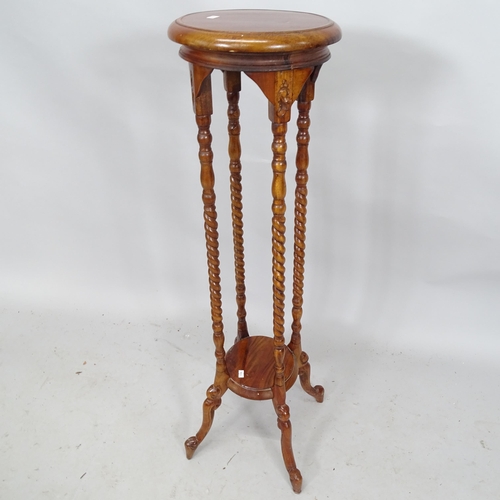 2277 - A reproduction mahogany torchere with barley twist columns. Height 103cm