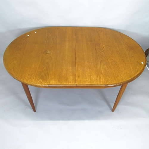 2500 - A mid-century G-plan teak oval extending dining table, 165cm (extending to 210cm) x 73cm x 112cm, an... 