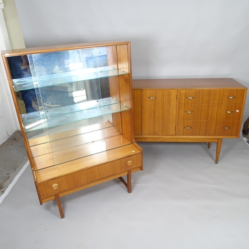 2501 - A mid century teak display cabinet with raised mirror back, two adjustable glass shelves and fitted ... 