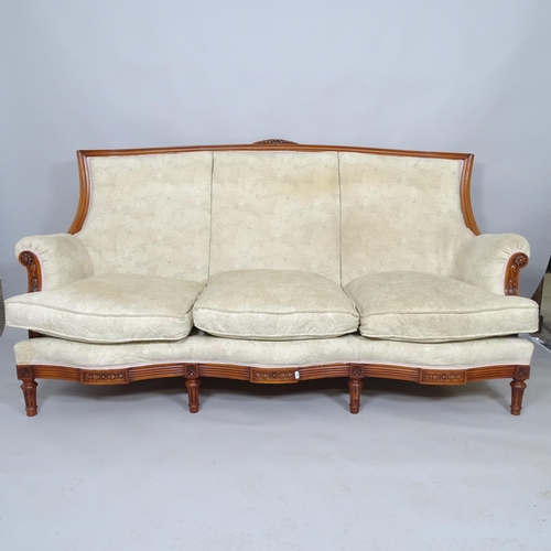 2512 - A contemporary continental-style mahogany three piece suite comprising a three seat sofa, 186cm x 94... 