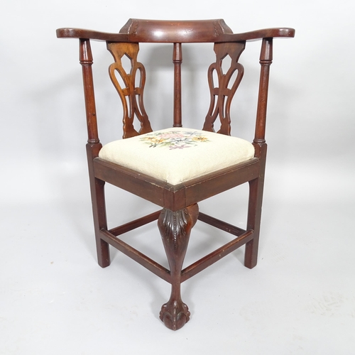 2516 - An antique child's mahogany and needlework upholstered corner armchair. H68cm