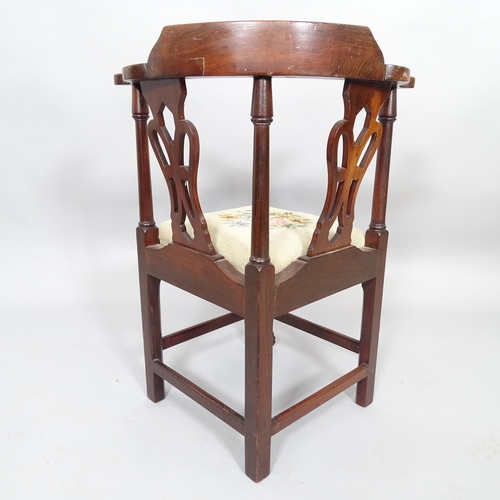 2516 - An antique child's mahogany and needlework upholstered corner armchair. H68cm