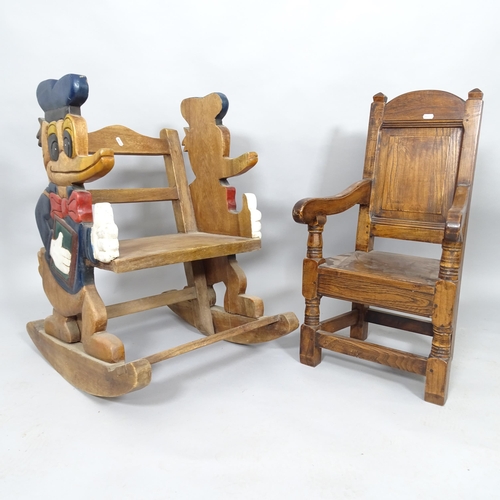 2517 - A vintage Oak child's rocking chair with carved and painted Donald Duck decoration, h 72cm and anoth... 