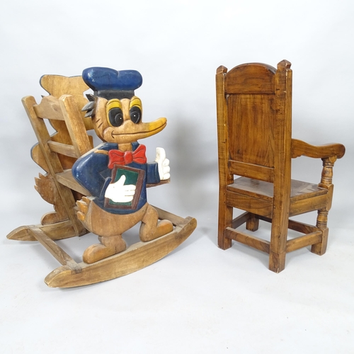 2517 - A vintage Oak child's rocking chair with carved and painted Donald Duck decoration, h 72cm and anoth... 