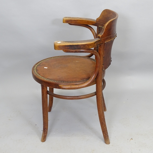 2528 - An early 20th century Thonet bentwood bow-arm chair, with studded red leather seat and impressed mak... 