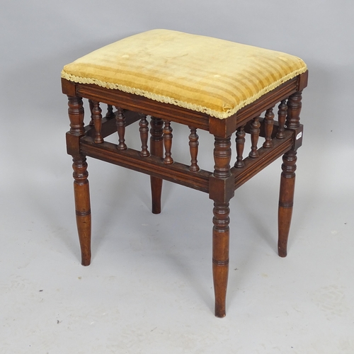 2529 - An antique mahogany spindle turned rectangular upholstered piano stool